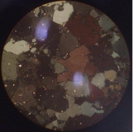 Polished ilmenite under polarized light.